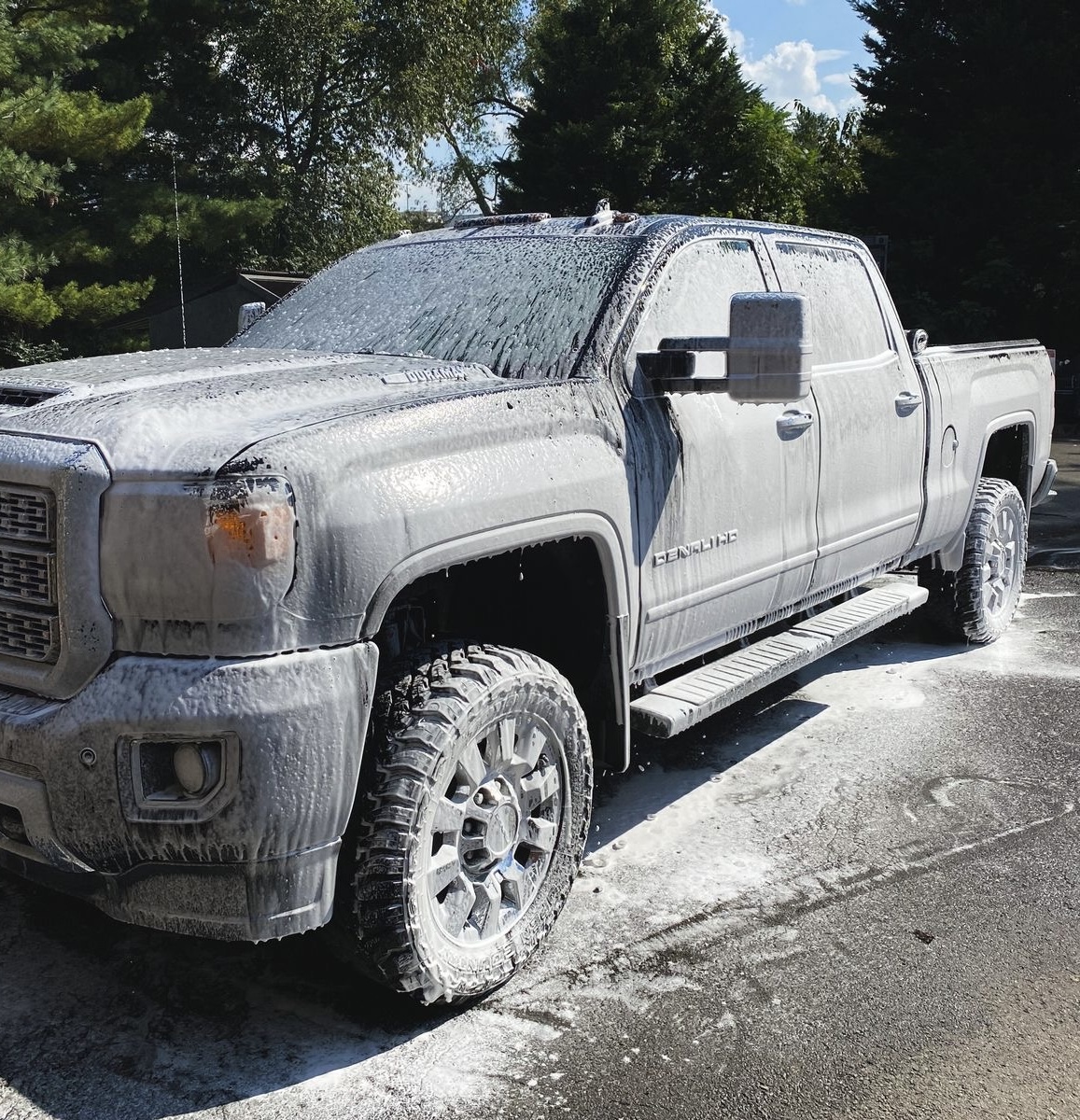 GMC truck covered in foam wash