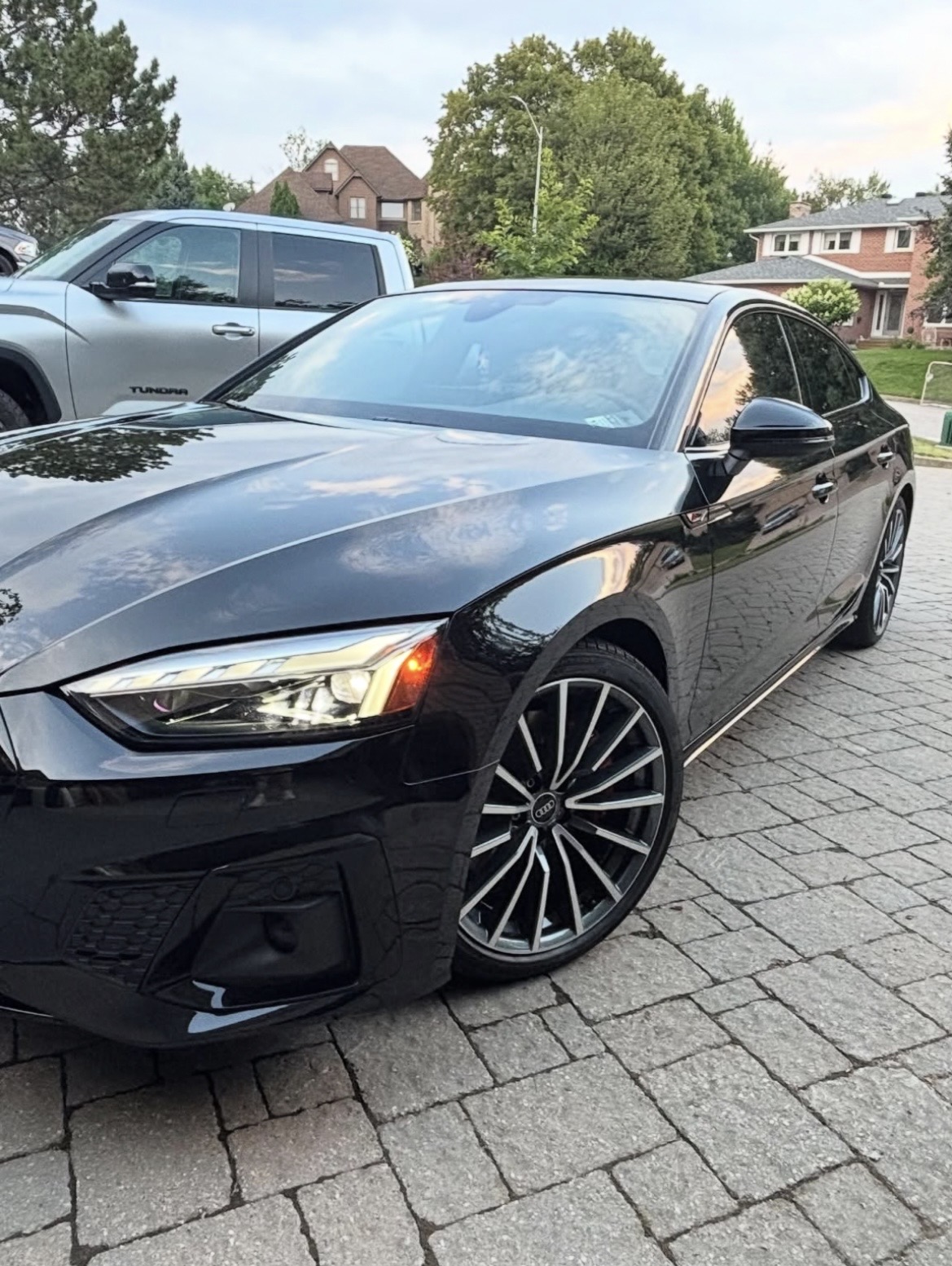 Freshly detailed black Audi shining in the driveway