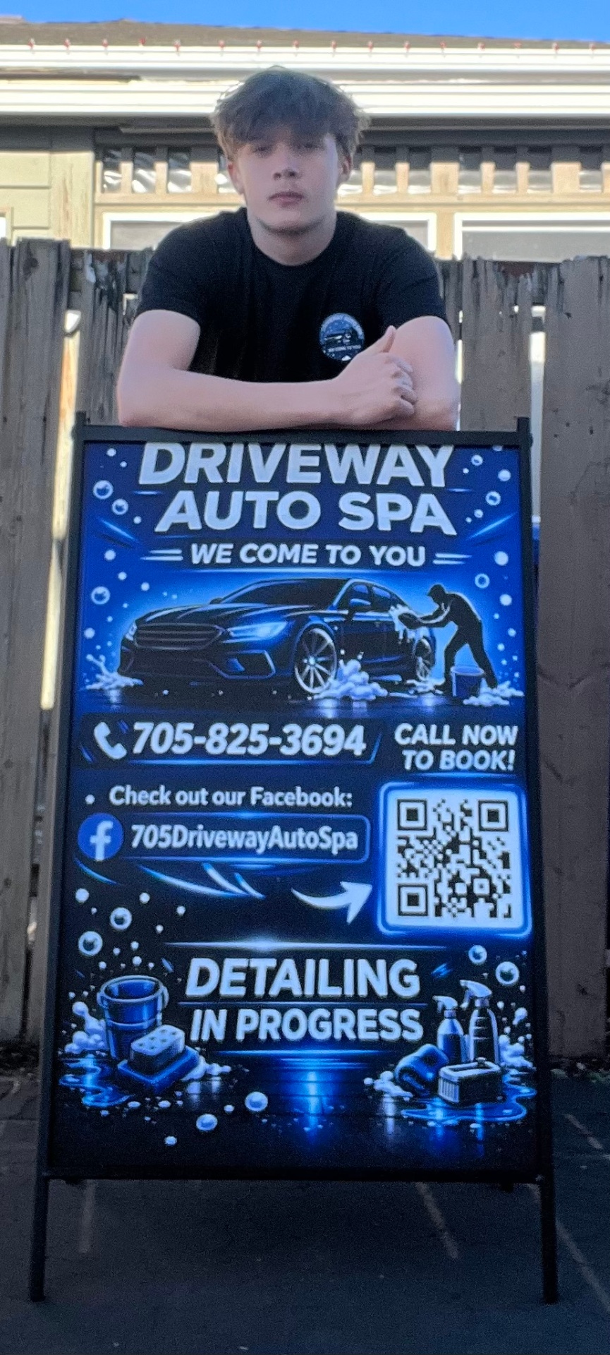 Jack Collins behind the Driveway Auto Spa mobile detailing sign